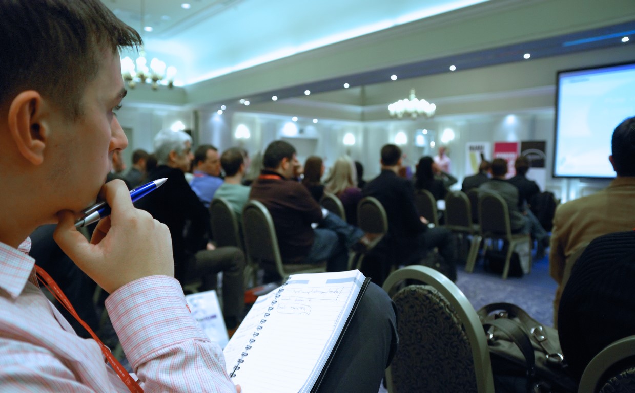 Scientists listen to a career coaching for post-docs presentation on how to market yourself